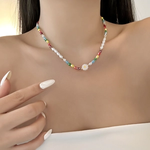 Close-up of a handmade beaded necklace with baroque pearls and colorful crystal beads
