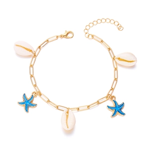 Detailed shot of golden link bracelet with white shells and blue starfish charms