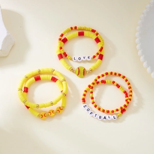 Detailed macro of a 3-piece softball beaded bracelet set with yellow and red heishi beads