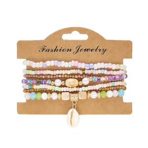 Bohemian multilayer beaded bracelet set with shell pendant on a display card