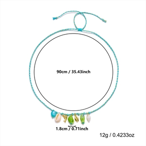 Detail view of woven blue necklace with shell and starfish pendants including dimensions