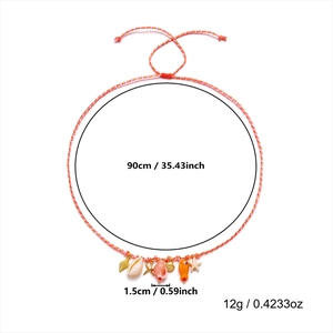 Detail view of woven ocean necklace with starfish charms and shell pendants on white background