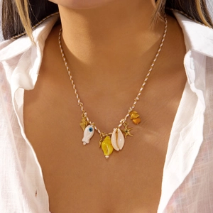 Detail view of woven cord necklace with shells, golden starfish and evil eye charms on model