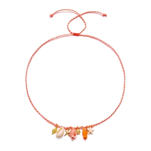 Detail of woven beach jewelry with starfish, shell, and colorful fish charms