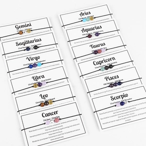 Detailed set of 12 Zodiac braided bracelets featuring natural stones on information cards