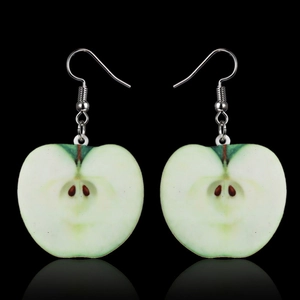 Macro shot of realistic green apple acrylic pendant earrings with silver metal hooks
