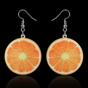 Detailed close-up of creative orange slice drop earrings with realistic fruit textures