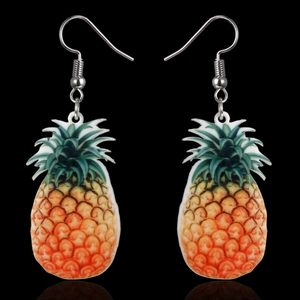 Detailed close-up of pineapple dangle earrings with vibrant colors on a black background
