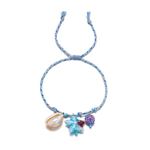 Detail of woven boho bracelet with conch shell, blue star charm and adjustable tassel cord
