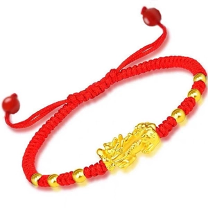 Handcrafted red braided string bracelet featuring a gold PiXiu charm and golden beads