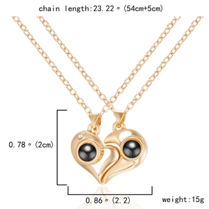 Detail view of magnetic heart couple necklace with size dimensions and gold chain