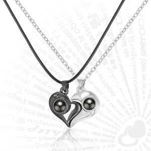 Detail view of magnetic heart projection necklaces with polished finish and woven cord