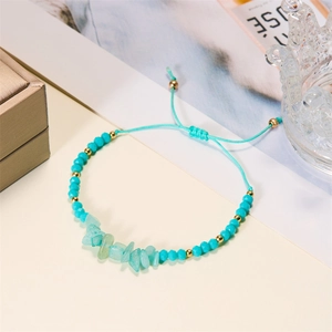 Adjustable hand-woven bracelet with turquoise stone chips and faceted beads