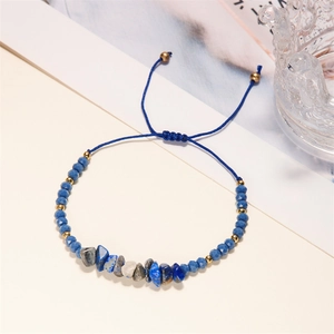 Handmade braided adjustable bracelet with blue natural stones and golden metal beads