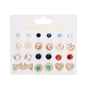 Detailed view of 12 pairs of fashion earrings including hearts and flowers on card