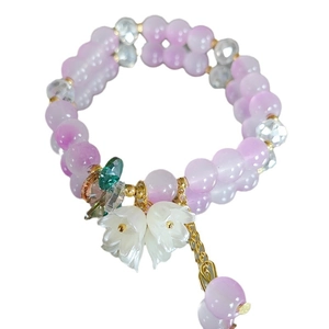 Elegant lily of the valley bracelet with purple crystal beads and floral pendants