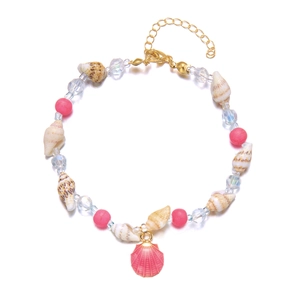 Detail of beaded shell anklet featuring pink matte beads and golden lobster clasp