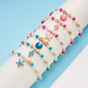 Five-piece ocean theme beaded bracelet set with starfish shell pendants and sea beads