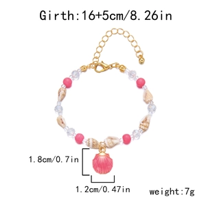 Detail of bohemian beach bracelet with pink beads, natural shells and gold lobster clasp