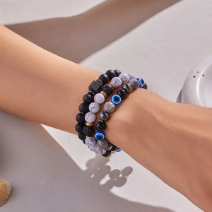 Three-piece stretch bracelet set with tiger eye, lava stone, and blue evil eye beads
