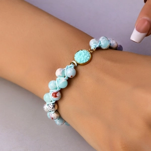 Pulsera tejida ajustable de piedras naturales con cuentas jaspeadas azules y elemento druzy