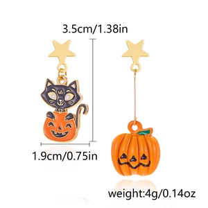 Detail view of asymmetric Halloween earrings with size labels, pumpkin and cat design