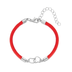 Detail of red braided rope bracelet featuring silver interlocking heart charms and clasp