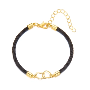 Detail of black woven rope bracelet with interlocking gold hearts and lobster clasp closure