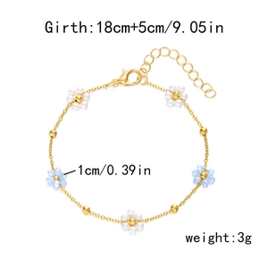 Chic gold-tone bracelet with white and light blue floral pearl charms and link chain