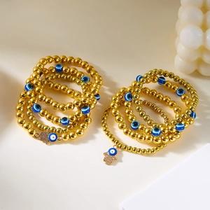 Boheems gouden kralen armbandenset met blauwe boze oog en hamsa hand bedeltjes