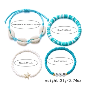 Set of four beach style bracelets featuring starfish, shells, and blue clay beads detail