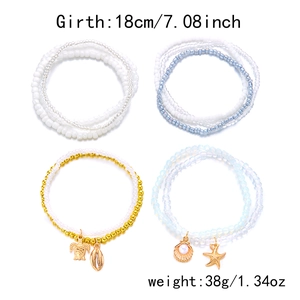 Detail showing multi-layer sea shell, starfish, and turtle bead bracelets with dimensions