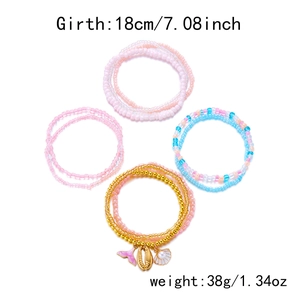 Detail of beaded bracelet set with pink fish tail and seashell charms 18cm 38g