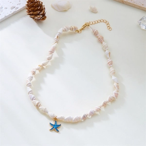 Detail of seashell necklace featuring a blue starfish pendant and natural shell textures