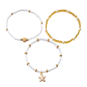 Bohemian starfish and seashell beaded anklet set with white pearls and gold accents