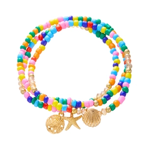 Detail of bohemian multilayer anklet with colorful seed beads and gold sea life charms