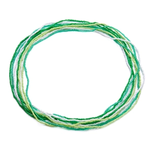 Close-up of multilayered green and white seed bead body chains on a white background