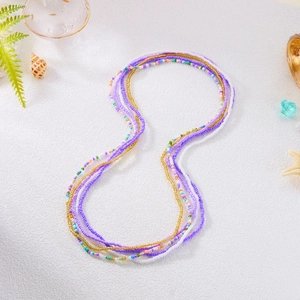 Detail of multi-layer colorful seed bead waist chains with sea shells and starfish decor