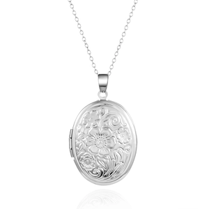 Détail d'un médaillon ovale en argent avec gravures florales et charnière latérale