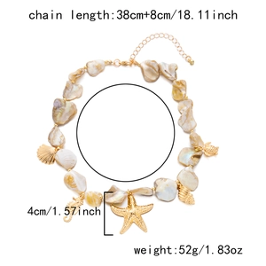 Detail of seashell necklace featuring golden seahorse and starfish pendants with shell beads