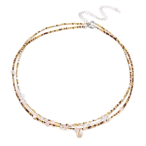 Detail of bohemian waist chain featuring natural shells, seed beads and colorful gravel