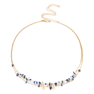 Detail of bohemian waist chain with sea shells, blue gravel and delicate gold chain