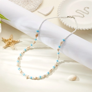 Detail view of Bohemian seashell and starfish waist chain with blue beads and silver clasp