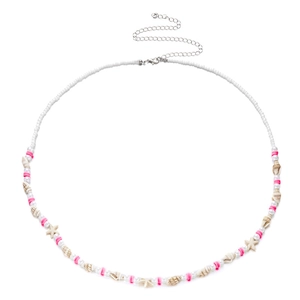 Detail of beach waist chain with pink heishi beads, shells and starfish charms