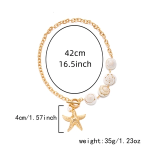 Detail of gold starfish shell necklace with faux pearl and dimensions measurement
