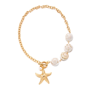 Detailed view of sea shell charms and gold starfish pendant on chunky layered necklace