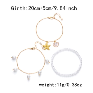 Detailed view of starfish and seashell charms on layered anklets with 20+5cm size info