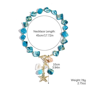 Detailed view of ocean style necklace featuring blue beads, starfish and shell charms