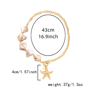 Detailed view of starfish pendant with OT buckle on a layered gold beaded necklace