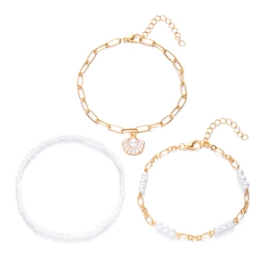 Detailed set of 3 beach anklets featuring starfish, shells, and pearls on gold chains